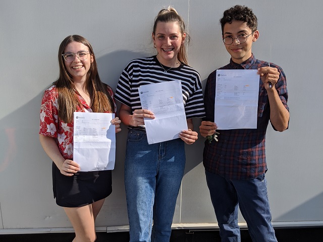 Three students with their 2020 results