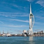 landscape picture of Spinnaker Tower on the water