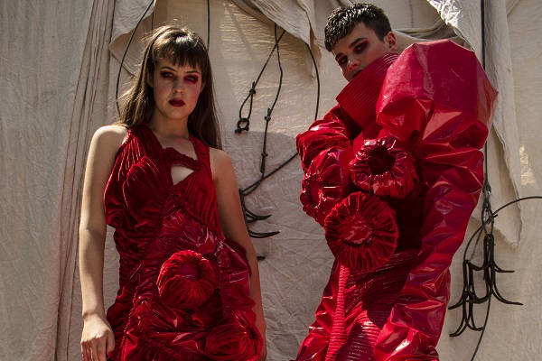 two students modelling fashion pieces made by Alton students