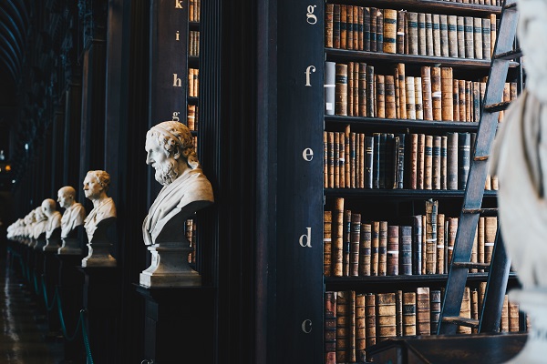 sculptures lining aisles of library books