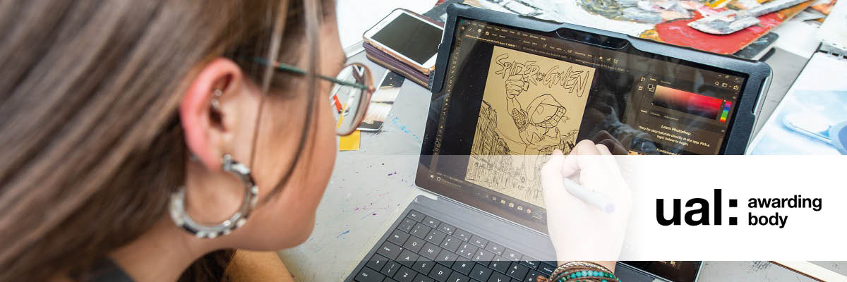 student drawing digitally on a tablet