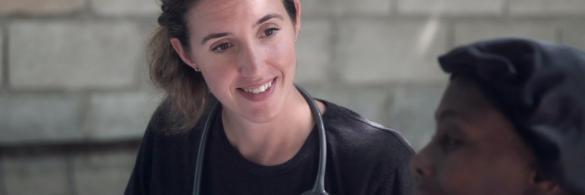 a nurse talking to a patient