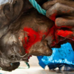 a statue face vandalised