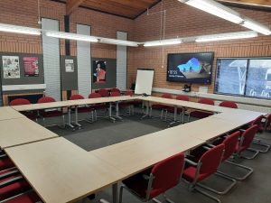 view of the conference suit with a boardroom style layout
