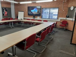view of the conference suit with a boardroom style layout