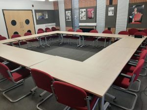 view of the conference suit with a boardroom style layout