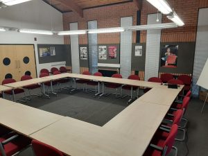 view of the conference suit with a boardroom style layout