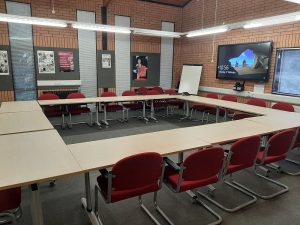 view of the conference suit with a boardroom style layout