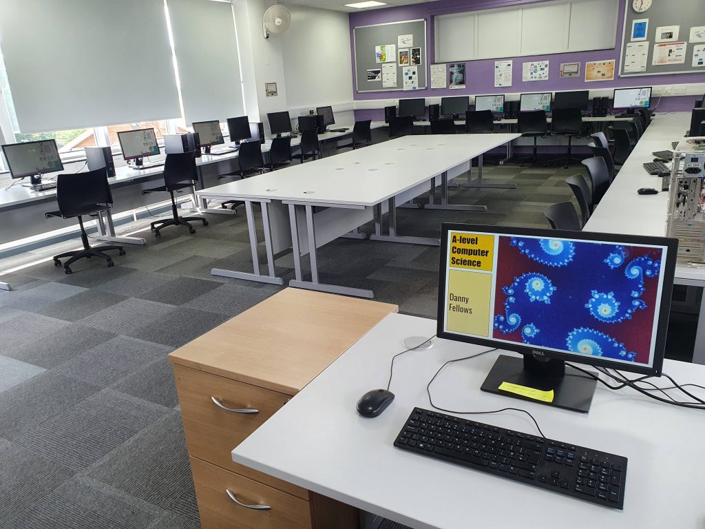 image of classroom with computers around the outside