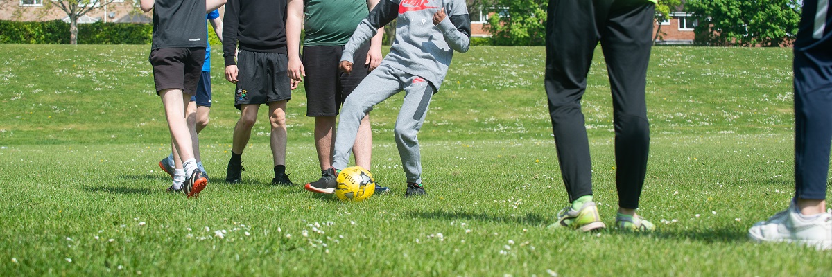 students playing football on a field