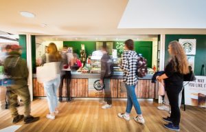 students standing at the starbucks area