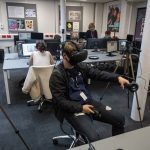 student playing with a VR headset