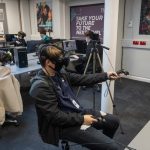student playing with a VR headset