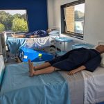 Patient simulators laying on hospital beds