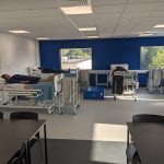 Patient simulators laying on hospital beds