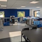 Patient simulators laying on hospital beds