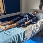 Patient simulators laying on hospital beds