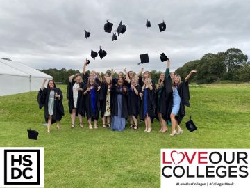 Students throwing their graduation caps in the air