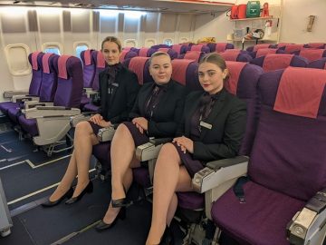 Toni, Zara and Faith sat in the HSDC airplane in their uniforms