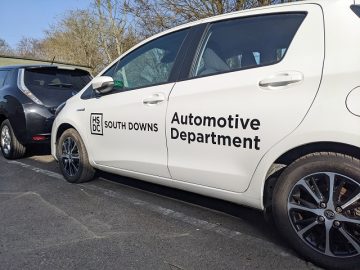 White car with HSDC South Downs Automotive Department on the side