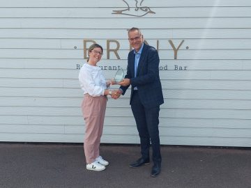 Mike Gaston with Lucy Branson, owner of The Coastal Kitchen Family