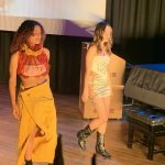 Two catwalk models in their outfits