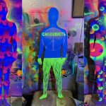 Three colourful figures featuring bright designs