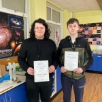 Students with their awards in classroom