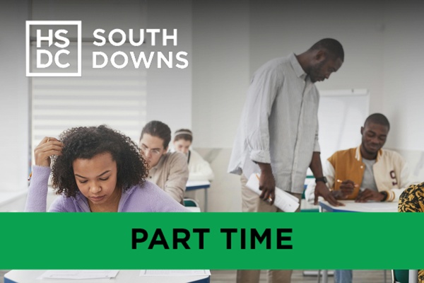 A teacher helping students in the classroom.