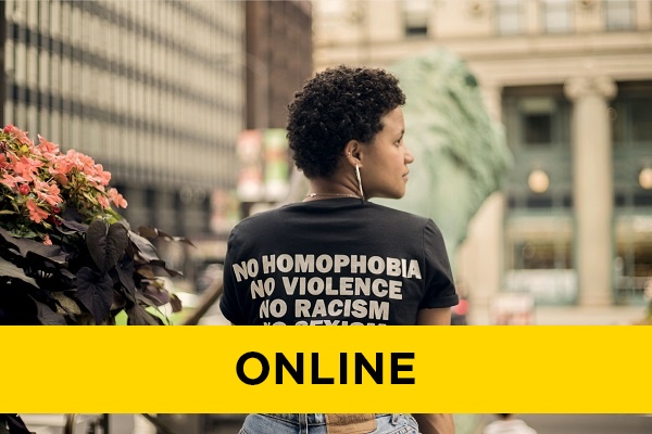 a women wearing a t-shirt that says 'no homophobia, no racism, no violence'