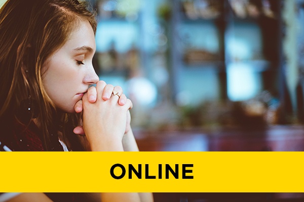 A woman with her eyes closed in deep thought