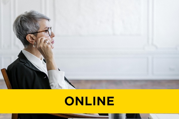 A therapist sat in a chair in thought.