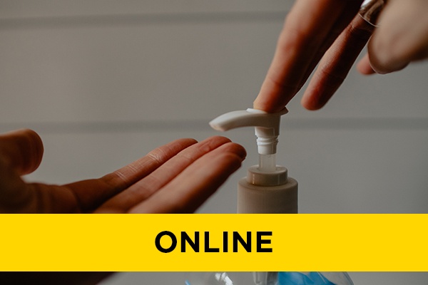 A closeup of someone using hand sanitizer.