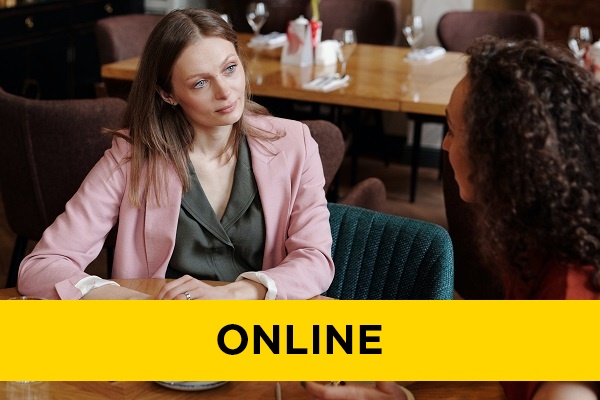 a woman listening intently to their female colleague