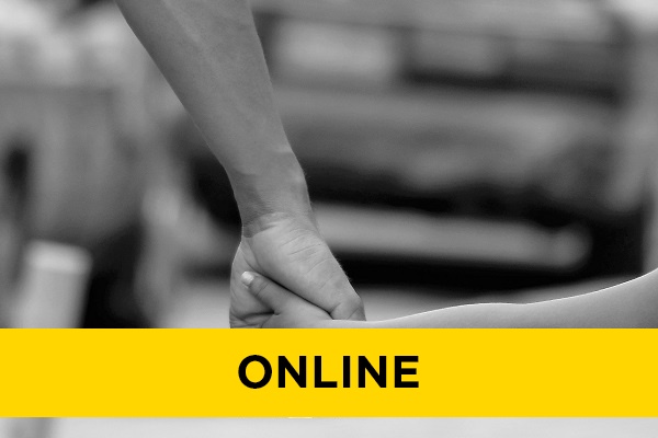 adult holding a young person's hand