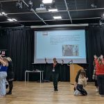 A photo of the RSC training session at HSDC in November 2024, showing two groups creating physical representations of churches.