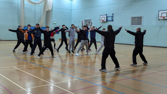 PDS Students Warming up with jumping jacks