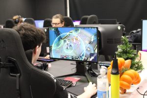 A student playing League of Legends at Winterfest.