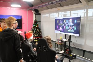 Students preparing to race each other in Mario Kart Wii at Winterfest.