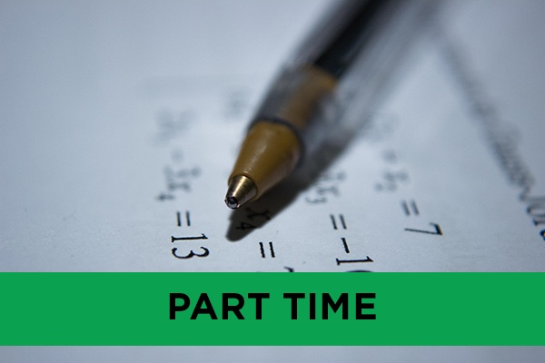 A close up of a pen resting on mathematical formulas.