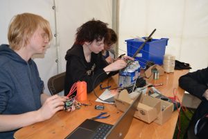 Members of Team Wendle building their satellite.