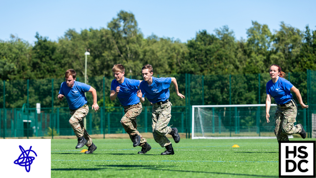 PDS students running across a field.