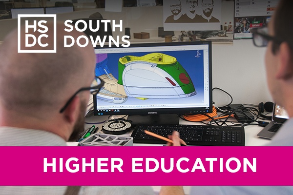 A teacher and a student working on AutoCAD