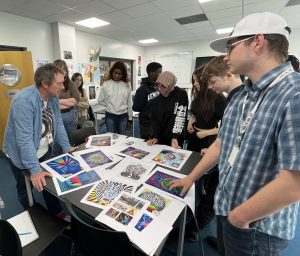 Mark working on the design of the mural with his students.