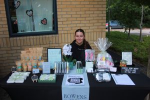 A student with their stand at the pop up market. 