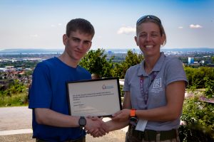 Joshua Thomas receiving his award. 