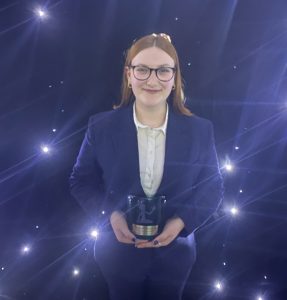 Mackenzie with her award. 