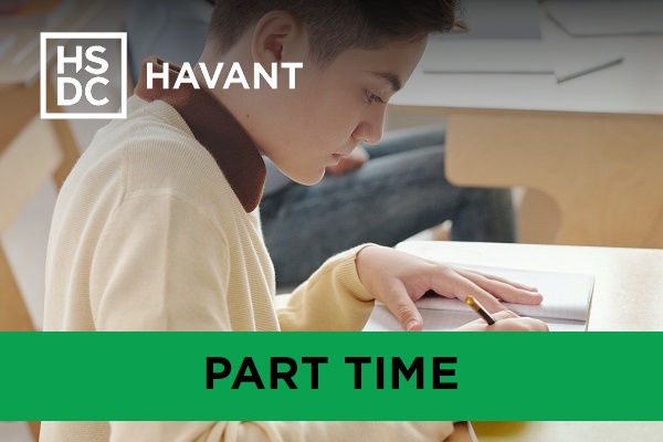 A student working at a school desk.