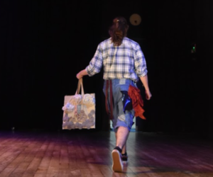 A student showcases their outfit at the Green Week catwalk show.