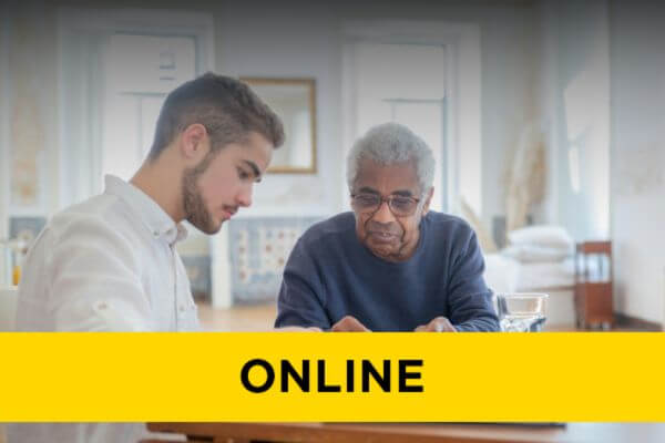 A young man helping an older gentleman.